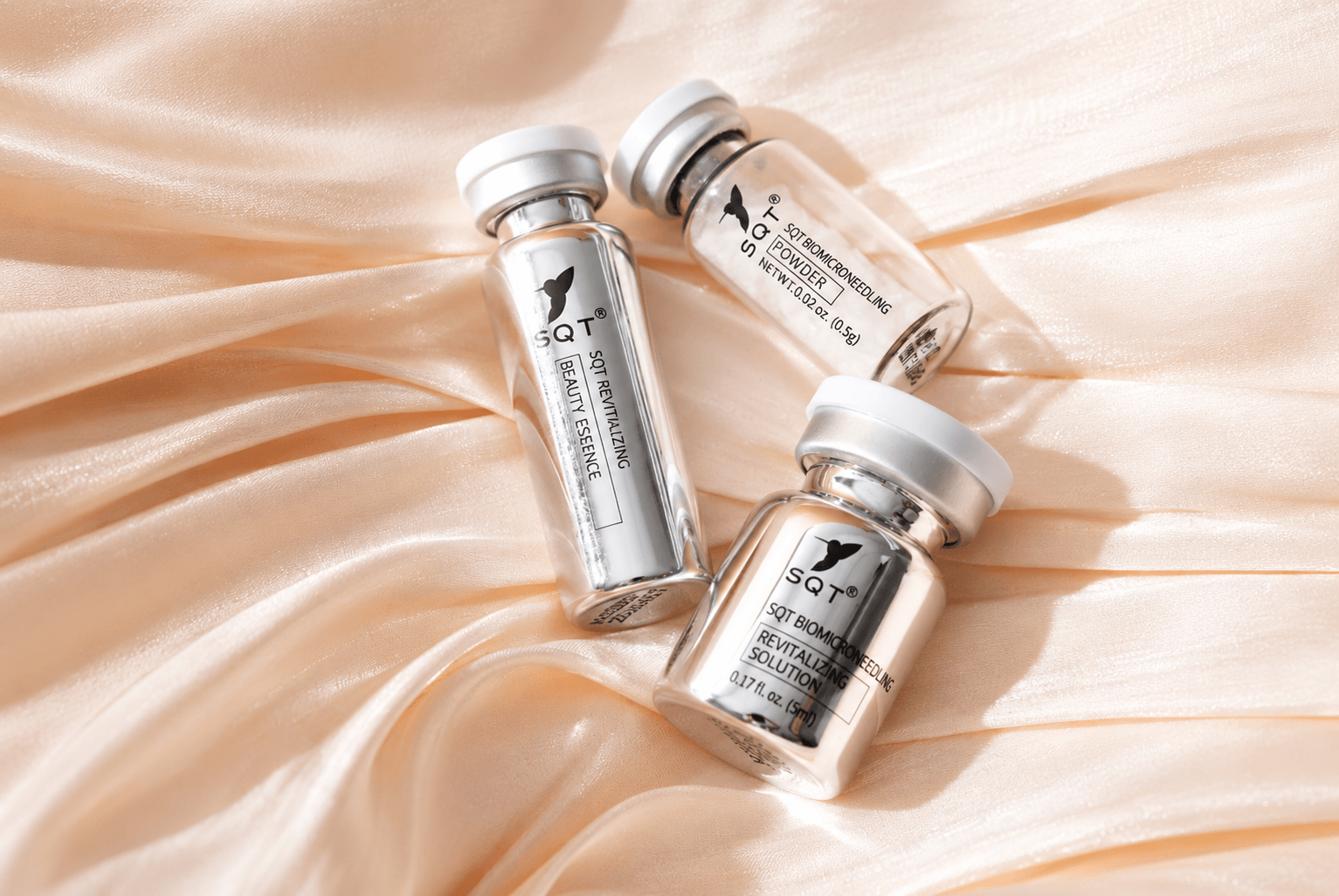 SQT Skincare Vials on Peach Silk